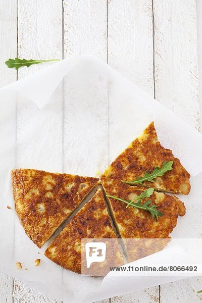 Potato tortilla with rocket  cut into slices