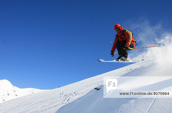 Puigmal (66) Skier in powder snow on the ski area surrounding the ski resort Font Romeu. Bump jumping  off-piste