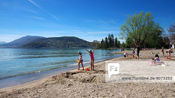Annecy (74) on April 06 2011: First sunny days on the beach of Lake Annecy.
