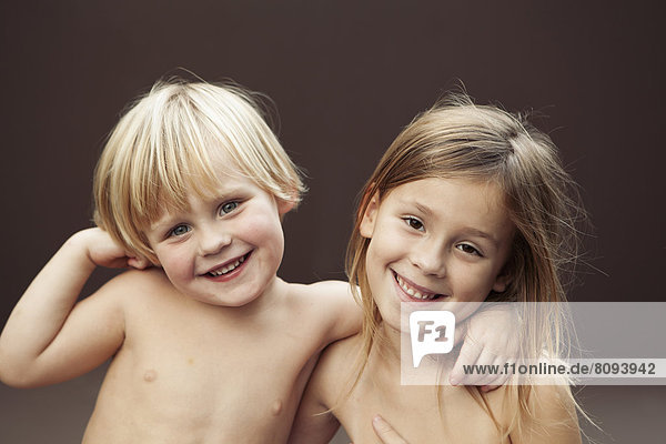Caucasian children smiling together