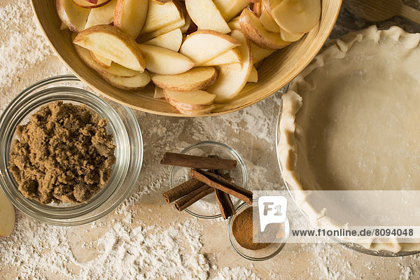 Close up of apples  spices and empty pie shell