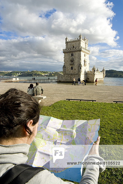 Tourist Watching A Map In Front Of Belem Tower  Belem  Portugal  March'08