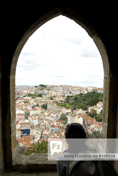 Young Woman Enjoying The Views Of The City From The Castle Of St Jorge  Lisbon  Portugal  March'08