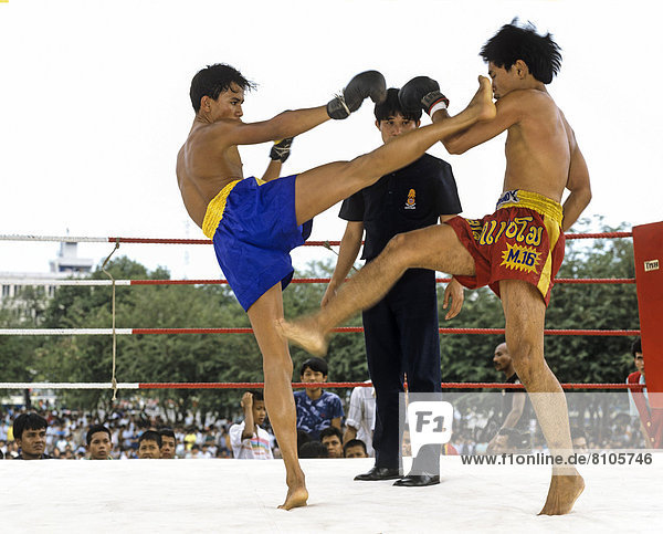 Muay Thai  Thai boxing  two men fighting in a boxing ring