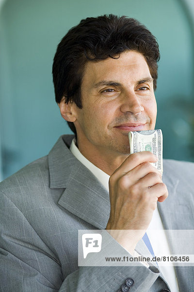 Businessman Holding Money