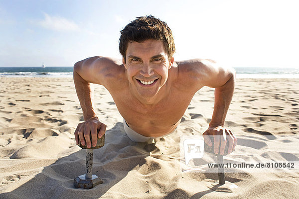 Portrait Of A Man Working Out On A Beach