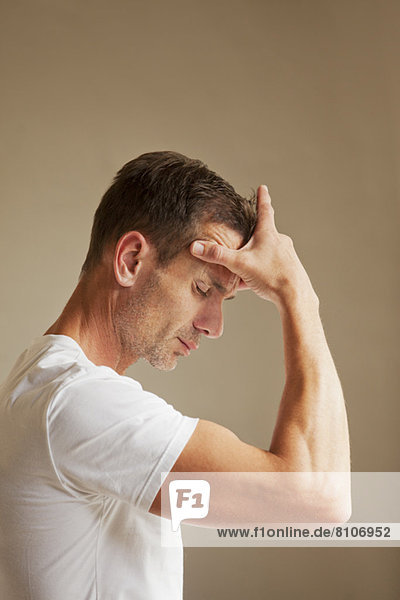 Man holding head in pain