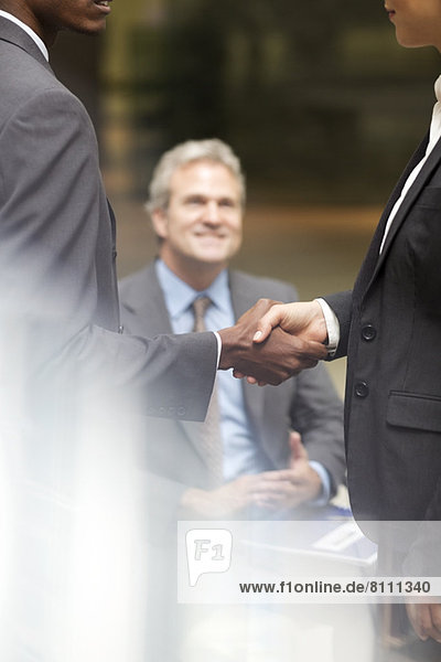Business people handshaking