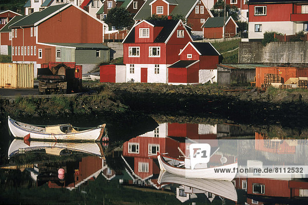 Denmark Faroe Islands coast village coastal village harbor calm reflection outdoors red quaint vacation destinations horizontal color image photography
