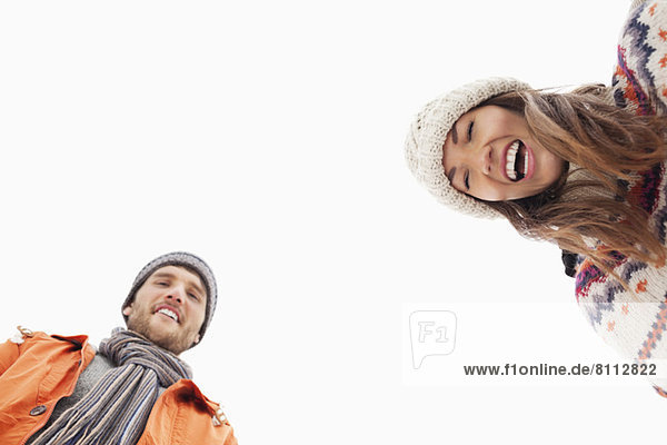 Low angle portrait of laughing couple