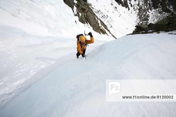 35-39 Years Adult Adventure Challenge Cold Temperature Color Image Day Effort Extreme Terrain Full Length Helmet High Angle View Horizontal Huntington's Ravine Ice Ice Axe Ice Climbing Men Mid Adult Mount Washington Mountain Nature New Hampshire One Person Outdoors Photography Presidential Range Risk Scenics Ski-Wear Snow Tuckerman's Ravine USA Warm Clothing Winter Sport Mt. Washington