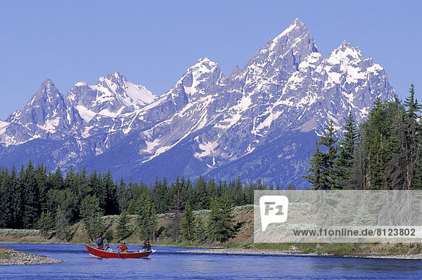 Blue Boat Clear Sky Color Image Day Extreme Terrain Group Of People Horizontal Lake Mountain fishing Lakeside Mountain Mountain Peak Outdoors Photography Snake River Snow Tree USA Water Wyoming Majestic Scenics Tranquil Scene Travel Travel Destinations