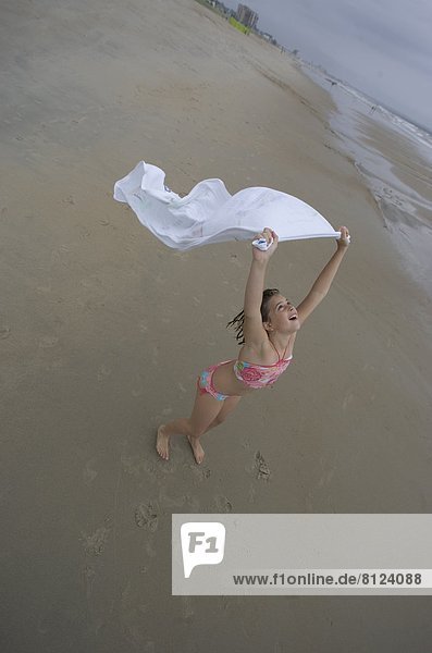 Beach Young girl Young girl Only Bathing Suit Caucasian Clear Sky Day Towel Cape Wind Breeze Human Hair Long Hair One One Girl Outdoors Smiling Tousled Wind Beauty Confidence Enjoyment Happiness Individuality Joy Vitality Color Image Horizontal Photography Child