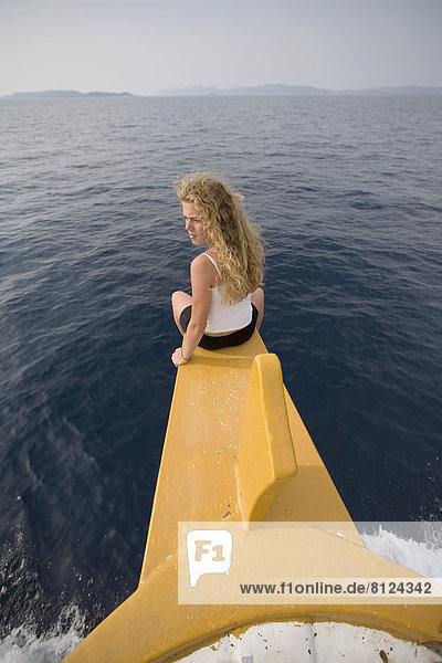Kornati National Park Boat Cruise tourist Mediterranean Croatia Adriatic sea water recreation bow relax sea breeze carefree girl curly hair blond blonde adventure summer vacation