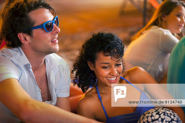 Young couple at indoor beach party