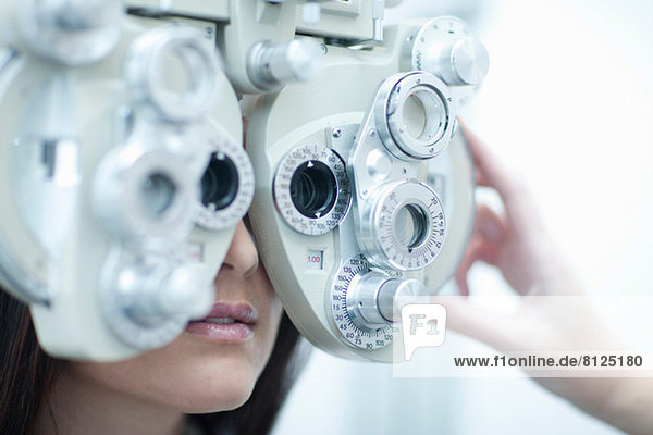Young woman having eye test