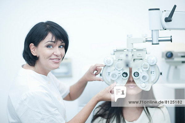 Young woman having eyes tested