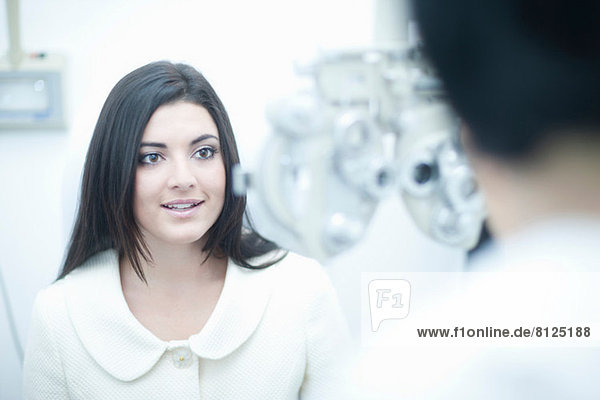 Young woman at opticians