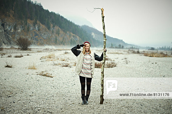 Woman holding log