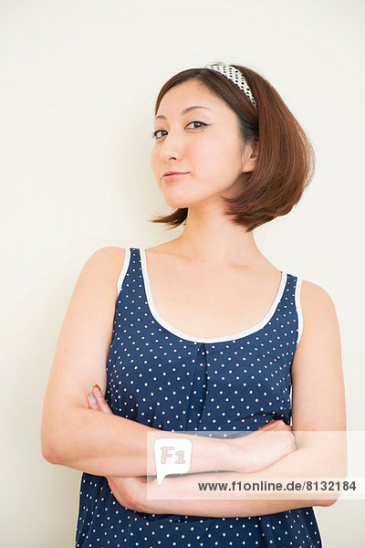 Woman wearing polka dots in haughty pose