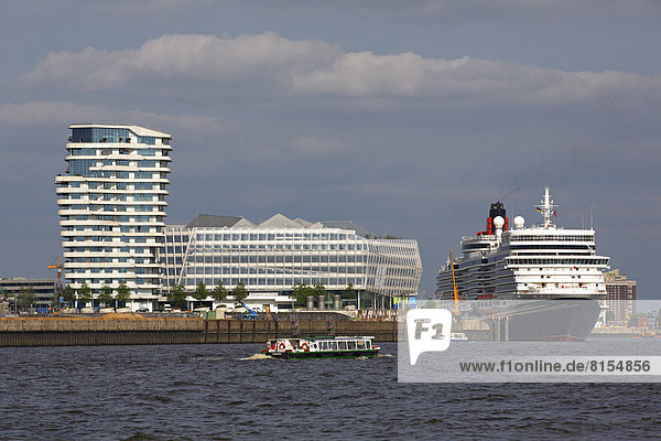 Cruise ship Queen Elizabeth in the Port of Hamburg  next to Marco Polo Tower and Unilever House