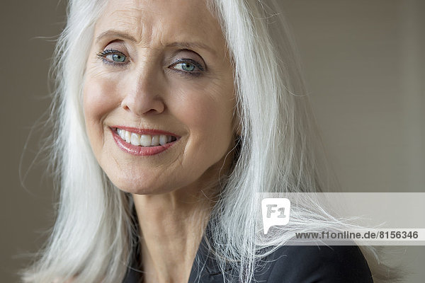 Older Caucasian businesswoman smiling