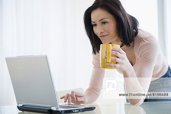 Caucasian woman using laptop