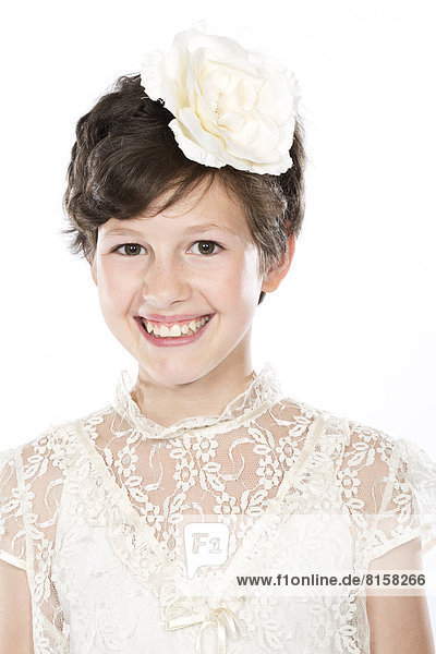 Portrait of girl against white background  smiling