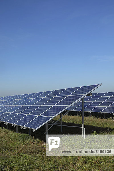 Germany  Bavaria  Solar panels on grass against sky