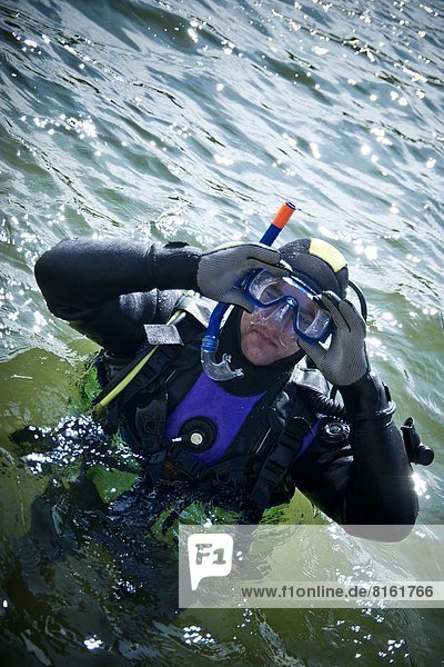 Man preparing to scuba dive