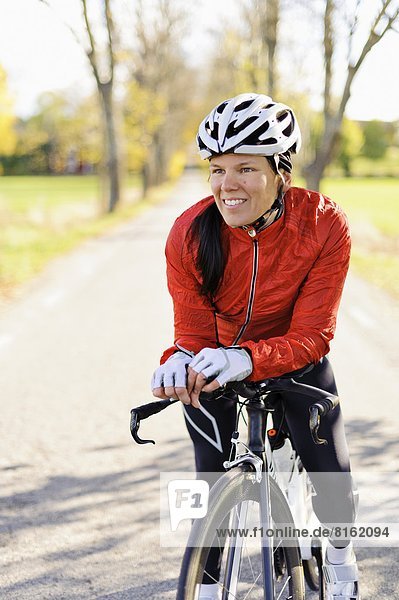 Portrait of woman riding bike