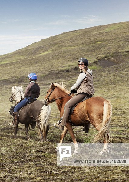 Women riding Icelandic horses