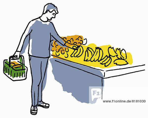 Mann kauft Bananen ein