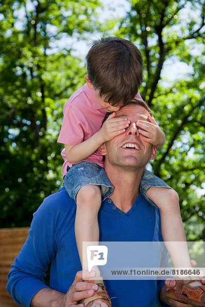 Child riding piggy back on father
