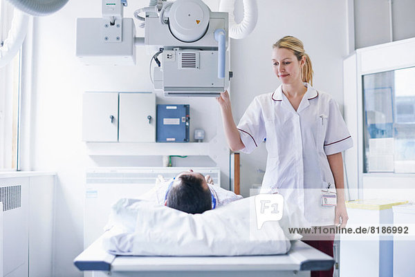 Radiologist scanning patient