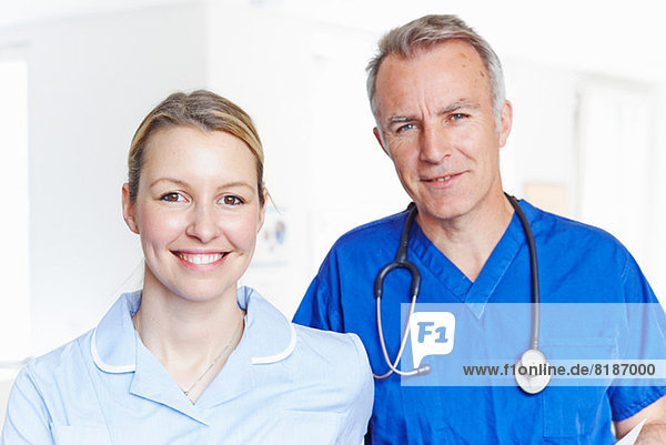 Portrait of doctor and nurse looking at camera