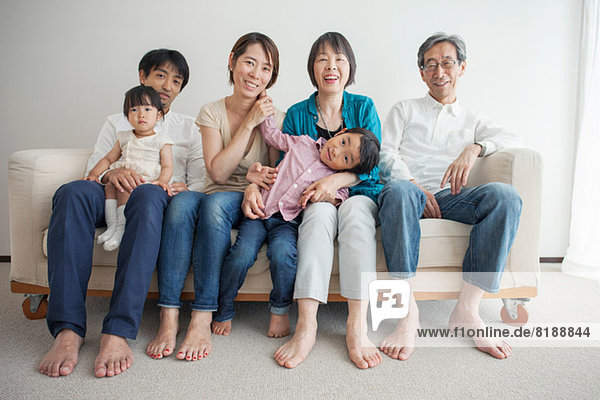 Three generation family sitting on sofa  portrait