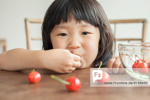 Girl eating cherries  portrait