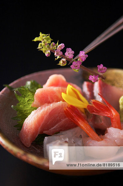 Still life with sushi and flower blossoms