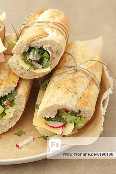 Sandwiches with ham  cheese and vegetables