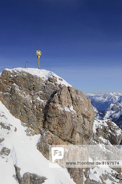 Germany  Bavaria  View of summit cross at Zugspitze Mountain