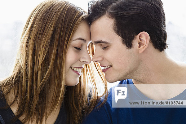 Germany  Bavaria  Munich  Young couple falling in love  smiling