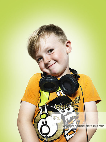 Smiling young boy with headphones