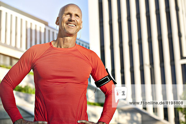Smiling mature athletic man outdoors