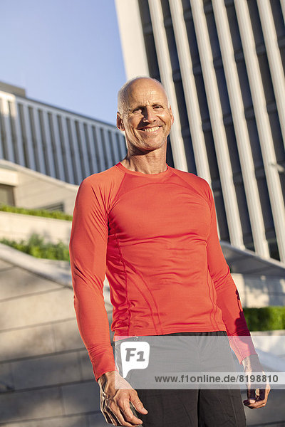 Smiling mature athletic man outdoors
