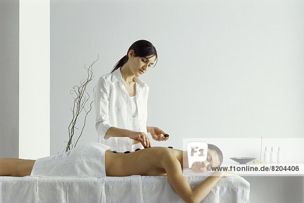 Woman receiving lastone therapy