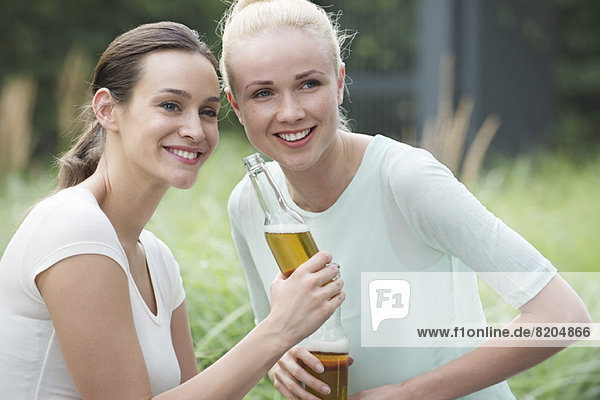 Women drinking beer together