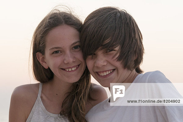Brother and sister together outdoors  portrait