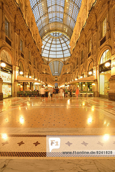 Luxury shopping arcade  roofed gallery of Galleria Vittorio Emanuele II  twilight shot at the blue hour