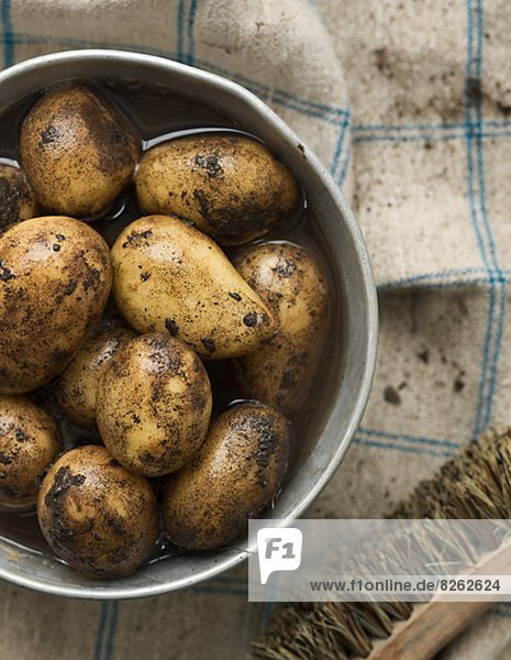 New potatoes in bucket  close-up